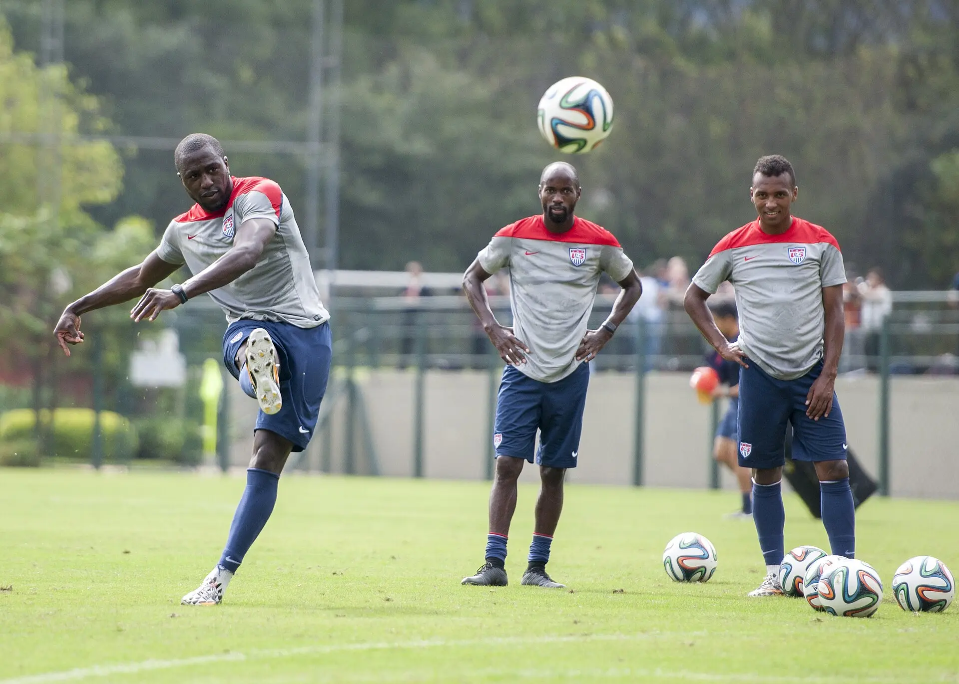 Jozy Altidore kicking a ball at USMNT training alongside teammates